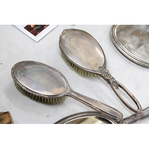 49 - FIVE MARKED STERLING SILVER ITEMS TO INCLUDE TWO BRUSHES, TWO MIRRORS AND AN EDGED COMB