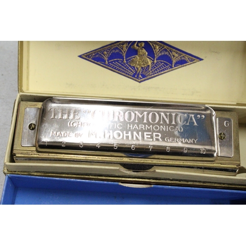 51 - FOUR BOXED HARMONICAS TO INCLUDE THE CHROMONICA, THE ECHO VAMPER, THE ECHO AND THE EDUCATOR 1