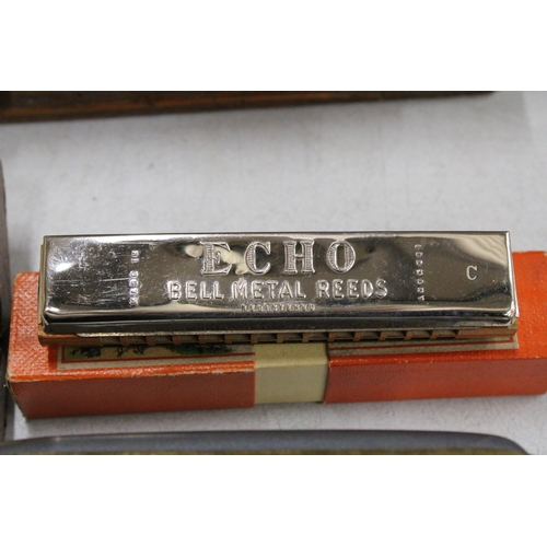 51 - FOUR BOXED HARMONICAS TO INCLUDE THE CHROMONICA, THE ECHO VAMPER, THE ECHO AND THE EDUCATOR 1