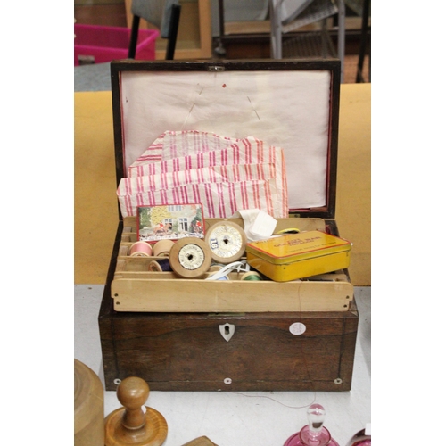 64 - AN OAK SEWING BOX WITH MOTHER OF PEARL INLAY AND CONTENTS TO INCLUDE COTTONS, NEEDLES, BUTTONS, PINS