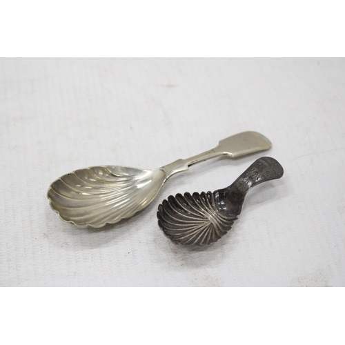 7 - A GEORGIAN SILVER TEA CADDY SPOON TOGETHER WITH A SILVER PLATED EXAMPLE