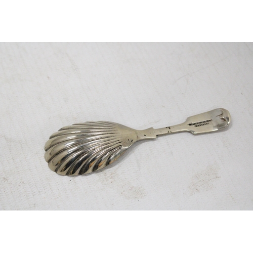 7 - A GEORGIAN SILVER TEA CADDY SPOON TOGETHER WITH A SILVER PLATED EXAMPLE