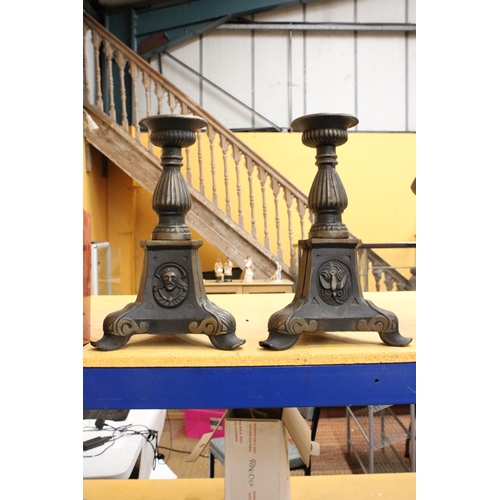 77 - TWO HEAVY METAL ECCLESIASTICAL CANDLESTICKS