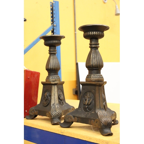 77 - TWO HEAVY METAL ECCLESIASTICAL CANDLESTICKS