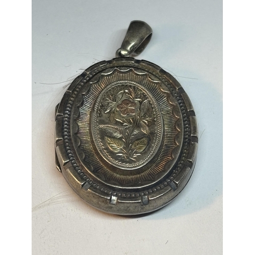 757 - A POSSIBLY SILVER MOURNING LOCKET WITH YELLOW AND ROSE GOLD COLOURED DECORATION