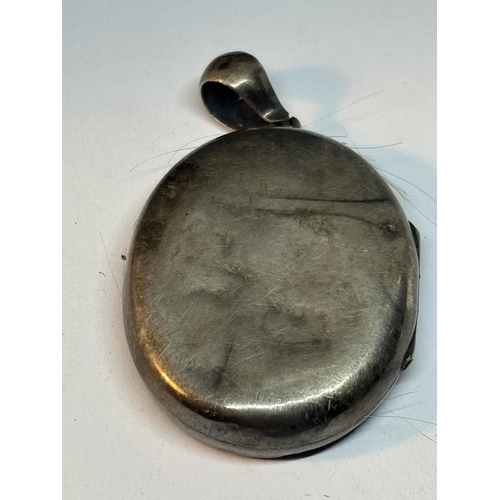 757 - A POSSIBLY SILVER MOURNING LOCKET WITH YELLOW AND ROSE GOLD COLOURED DECORATION