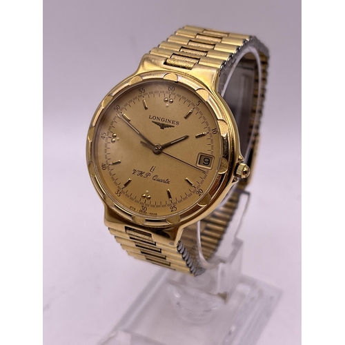 500 - A GOLD PLATED VINTAGE LONGINES CONQUEST VHP QAURTZ WRIST WATCH WITH ORIGINAL BRACELET