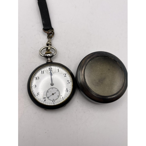 513 - AN ANTIQUE OMEGA GENTS GUN METAL POCKET WATCH WITH LEATHER ALBERT 47MM SEEN WORKING BUT NO WARRANTY