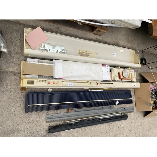 2371 - AN IMPERIAL KNITMASTER KNITTING MACHINE AND ACCESSORIES