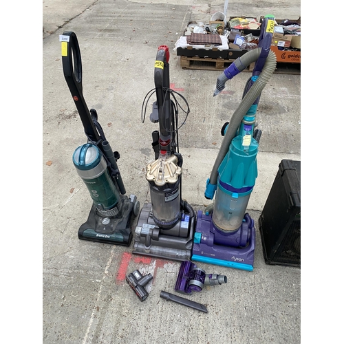 2389 - THREE VARIOUS VACUUM CLEANERS TO INCLUDE A DYSON DC27 ETC