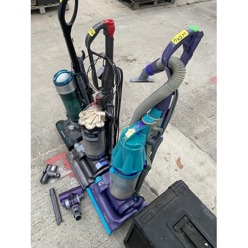 2389 - THREE VARIOUS VACUUM CLEANERS TO INCLUDE A DYSON DC27 ETC