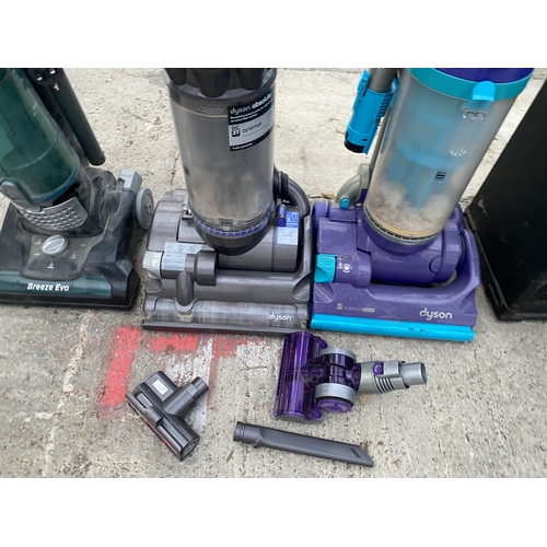 2389 - THREE VARIOUS VACUUM CLEANERS TO INCLUDE A DYSON DC27 ETC