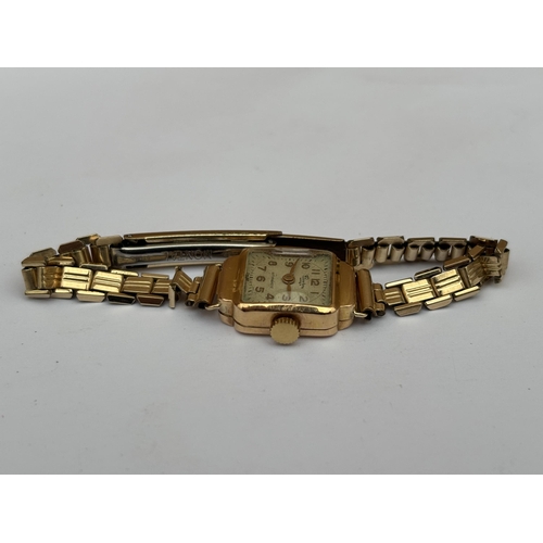 559 - A VINTAGE 18CT GOLD CASED LADIES WRIST WATCH ON A GOLD PLATED STRAP