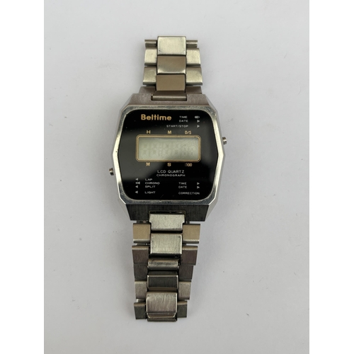 560A - A 1980'S BELTIME WATCH CO. LTD, LCD DIGITAL QUARTZ GENTS WRIST WATCH WITH STEEL STRAP, SERIAL NO. 20... 