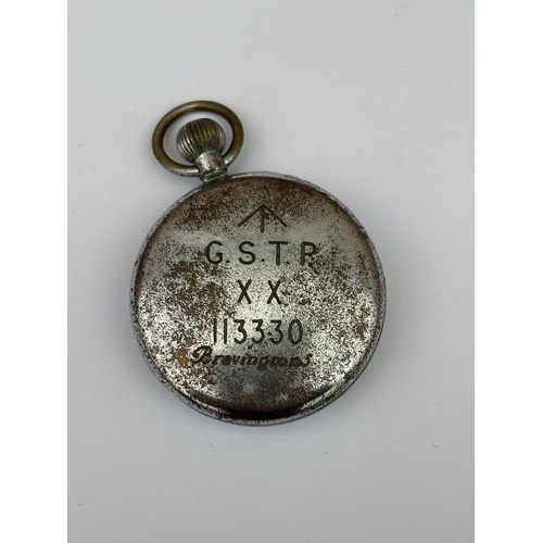 563 - A VINTAGE BLACK FACED MILITARY POCKET WATCH MARKED BRAVINGTONS G.S.T.P XX 11330