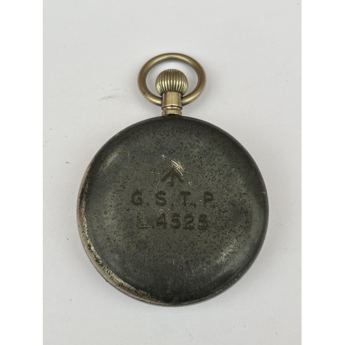 565 - A VINTAGE BLACK FACED MILITARY POCKET WATCH MARKED G.S.T.P L 4525