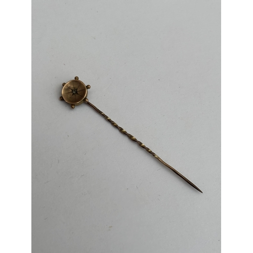 574 - A 9CT GOLD AND DIAMOND STICK PIN, GROSS WEIGHT 0.6 G