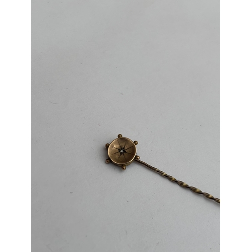 574 - A 9CT GOLD AND DIAMOND STICK PIN, GROSS WEIGHT 0.6 G