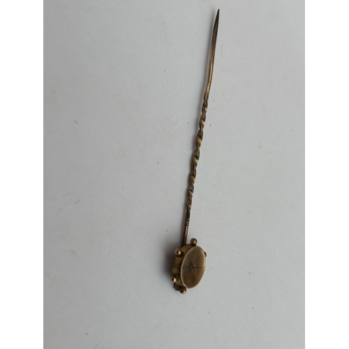 574 - A 9CT GOLD AND DIAMOND STICK PIN, GROSS WEIGHT 0.6 G