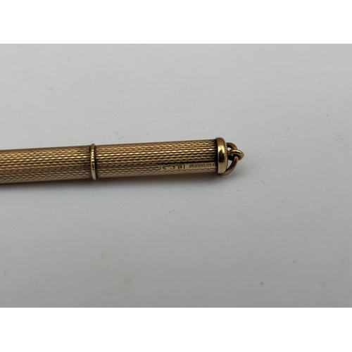 577 - A HALLMARKED 9CT GOLD PROPELLING TOOTHPICK, WEIGHT 5.5 GRAMS