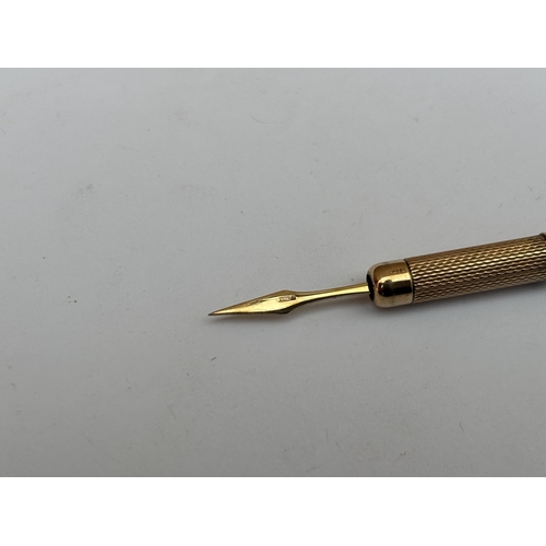 577 - A HALLMARKED 9CT GOLD PROPELLING TOOTHPICK, WEIGHT 5.5 GRAMS