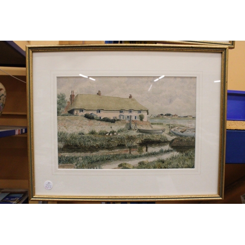 903 - TWO FRAMED WATERCOLOURS OF COTTAGES BY THE RIVER SIGNED E C WADLOW, ONE 1947, THE OTHER 1953