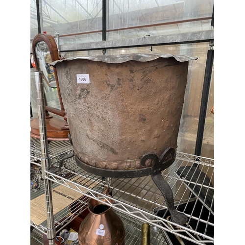 1606 - A VINTAGE CIRCULAR COPPER LOG BUCKET WITH WROUGHT IRON STAND