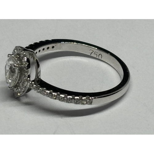 128 - AN 18 CARAT WHITE GOLD RING CONTAINING PEAR AND ROUND BRILLIANT DIAMONDS 0.4 & 0.7 CTS SIZE L GROSS ... 