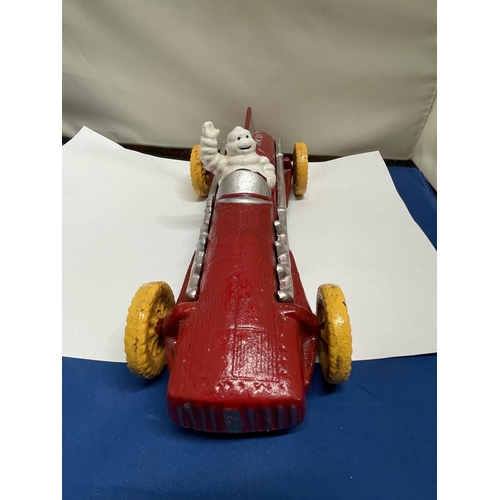 14 - A RED CAST MICHELIN MAN RACING CAR