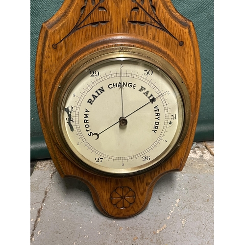 33 - A WALL HANGING BAROMETER