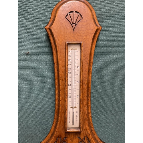 33 - A WALL HANGING BAROMETER