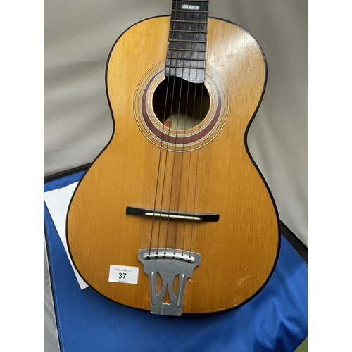 37 - AN ACCOUSTIC GUITAR