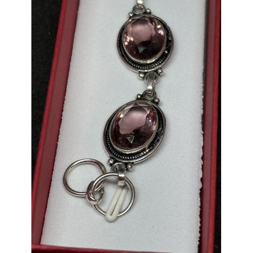 47 - A MARKED 925 SILVER AND AMETHYST BRACELET IN A PRESENTATION BOX