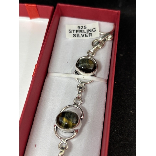 49 - A MARKED 925 SILVER JASPER TIGERS EYE BRACELET IN A PRESENTATION BOX