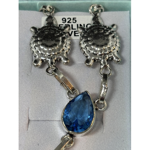 54 - A MARKED 925 SILVER TURTLE AND STARFISH NECKLACE WITH TOPAZ IN A PRESENTATION BOX