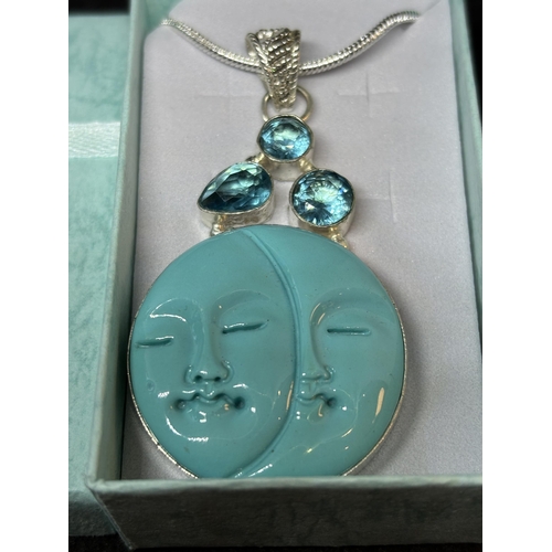 56 - A MARKED 925 SILVER LARGE MOONFACE PENDANT IN A PRESENTATION BOX