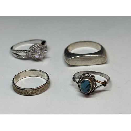 67 - FOUR VARIOUS SILVER RINGS