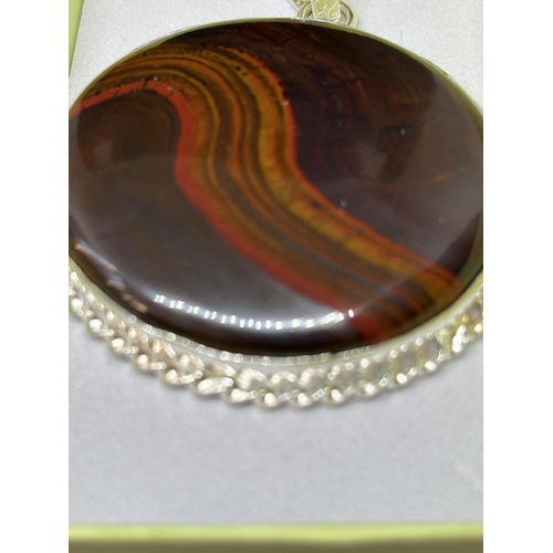 97 - A MARKED 925 SILVER LARGE TIGERS EYE PENDANT IN A PRESENTATION BOX