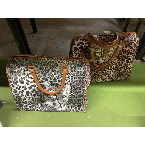 1208 - TWO AS NEW LARGE SHOPPER BAGS WITH LEOPARD THEMED PRINTS