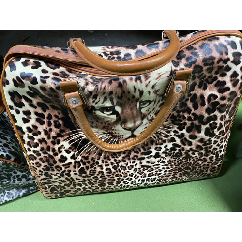 1208 - TWO AS NEW LARGE SHOPPER BAGS WITH LEOPARD THEMED PRINTS