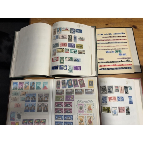 483A - FOUR STOCK ALBUMS CONTAINING GB AND WORLD STAMPS