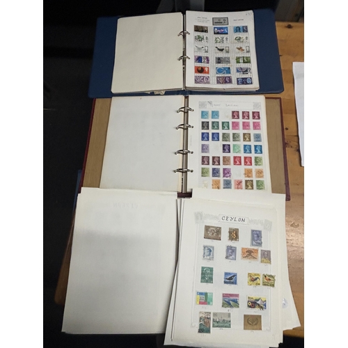 485A - THREE STOCK ALBUMS CONTAINING GB AND WORLD STAMPS