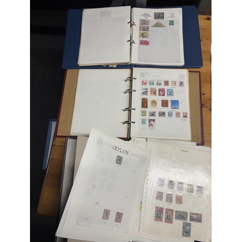 485A - THREE STOCK ALBUMS CONTAINING GB AND WORLD STAMPS