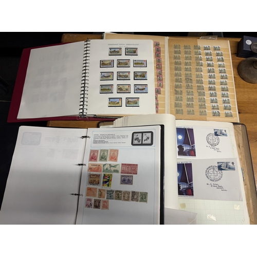 492A - FOUR STOCK ALBUMS CONTAINING GB AND WORLD STAMPS