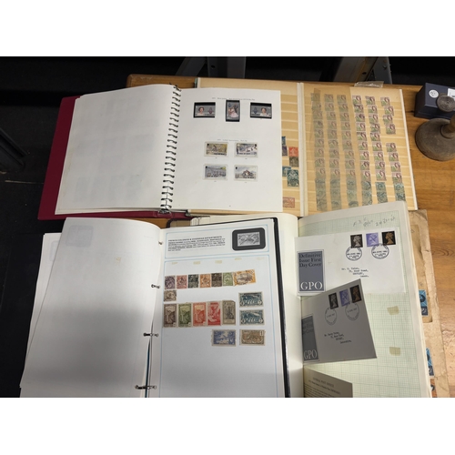 492A - FOUR STOCK ALBUMS CONTAINING GB AND WORLD STAMPS