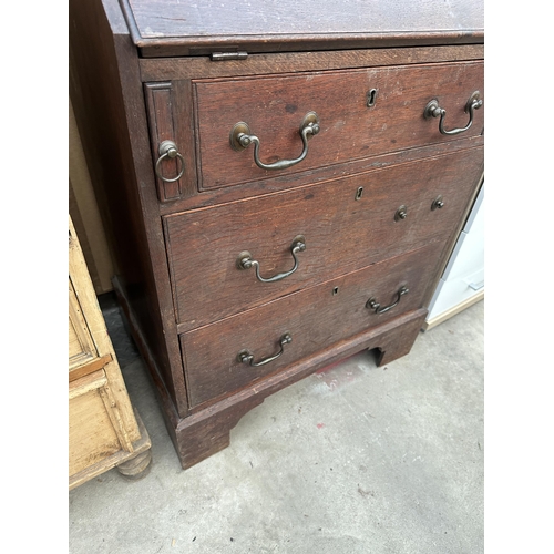 2928 - AN OAK GEORGE 111 STYLE BUREAU WITH THREE DRAWERS TO BASE ON BRACKET FEET, 26.5