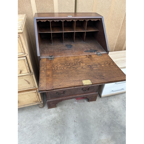 2928 - AN OAK GEORGE 111 STYLE BUREAU WITH THREE DRAWERS TO BASE ON BRACKET FEET, 26.5