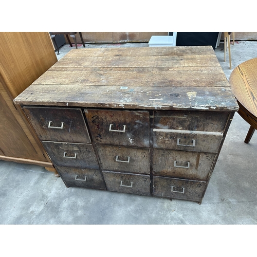 2933 - A WOODEN TEN DRAWER STORAGE CHEST WITH BRASS HANDLES, 42.5