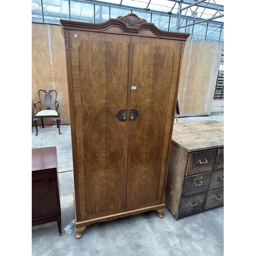 2934 - A MID 20TH CENTURY WALNUT 'HEATHLAND FURNITURE' TWO DOOR WARDROBE ON CABRIOLE LEGS, 38