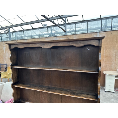 2944 - A REPRODUCTION OAK DRESSER WITH TWO DRAWERS, CUPBOARD AND PLATE RACK, 49